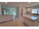 Modern kitchen with an island and white cabinets at 13392 Sw 33Rd Ct, Ocala, FL 34473