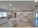 Modern kitchen with an island and white cabinets at 13392 Sw 33Rd Ct, Ocala, FL 34473