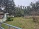 Large backyard with mature trees and shed at 1504 Ne 31St Pl, Ocala, FL 34479