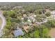 Wider aerial view showing neighborhood and surrounding nature at 19586 Sw 84Th Pl, Dunnellon, FL 34432