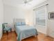 Cozy bedroom with a light blue bedspread and terracotta tile floor at 19586 Sw 84Th Pl, Dunnellon, FL 34432