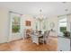 Formal dining room with chandelier and view to backyard at 19586 Sw 84Th Pl, Dunnellon, FL 34432