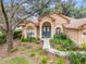 Close-up view of the house's front entrance with teal double doors at 19586 Sw 84Th Pl, Dunnellon, FL 34432