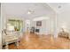 Bright living room with terracotta floors, fireplace, and access to patio at 19586 Sw 84Th Pl, Dunnellon, FL 34432