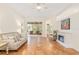 Living area with tiled floor, sliding glass doors and fireplace at 19586 Sw 84Th Pl, Dunnellon, FL 34432