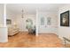 Open living room with terracotta tile floors and a cozy fireplace at 19586 Sw 84Th Pl, Dunnellon, FL 34432