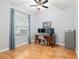 Home office with wood desk, two monitors, and ceiling fan at 19586 Sw 84Th Pl, Dunnellon, FL 34432