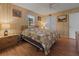 Bright bedroom featuring wood floors and a ceiling fan at 20635 Sw 63Rd Pl, Dunnellon, FL 34431