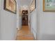 Home hallway with wood floors and built-in shelving at 20635 Sw 63Rd Pl, Dunnellon, FL 34431