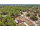 Aerial view showing a house's location within a larger wooded community at 21590 Sw 84Th Loop, Dunnellon, FL 34431