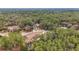 Aerial view of a house nestled in a wooded area with a large yard at 21590 Sw 84Th Loop, Dunnellon, FL 34431