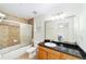 Bathroom with granite countertop and large mirror at 21590 Sw 84Th Loop, Dunnellon, FL 34431