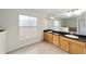 Bathroom with double vanity, granite countertops, and large mirror at 21590 Sw 84Th Loop, Dunnellon, FL 34431