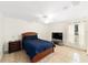 Bedroom with ceiling fan and window overlooking the backyard at 21590 Sw 84Th Loop, Dunnellon, FL 34431