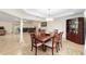 Dining room with wooden table and chairs, and built-in hutch at 21590 Sw 84Th Loop, Dunnellon, FL 34431