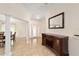 Open entryway with tile floors, columns, and wooden cabinet at 21590 Sw 84Th Loop, Dunnellon, FL 34431