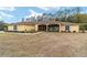 One story home with a large yard and screened porch at 21590 Sw 84Th Loop, Dunnellon, FL 34431