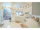 Bright and well-equipped kitchen with white cabinets, and tile flooring at 2831 Sw 139Th St, Ocala, FL 34473