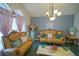 Living room with elegant yellow sofas and a decorative coffee table at 2831 Sw 139Th St, Ocala, FL 34473