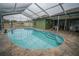 Enclosed kidney-shaped pool with tiled deck at 2831 Sw 139Th St, Ocala, FL 34473