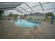 Enclosed kidney-shaped pool with tiled deck at 2831 Sw 139Th St, Ocala, FL 34473