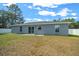 Large backyard with a new home and white fence at 307 Marion Oaks Pass, Ocala, FL 34473