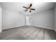 Large bedroom with ceiling fan and neutral carpeting at 307 Marion Oaks Pass, Ocala, FL 34473