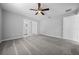 Bright bedroom featuring ceiling fan and plush carpeting at 307 Marion Oaks Pass, Ocala, FL 34473