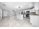 Modern kitchen with island, stainless steel appliances, and white cabinets at 307 Marion Oaks Pass, Ocala, FL 34473