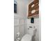 Small bathroom with a toilet and a rustic wooden letter B decor at 4074 Sw 47Th Ct, Ocala, FL 34474