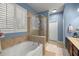 Bathroom with a large soaking tub and a separate shower at 4074 Sw 47Th Ct, Ocala, FL 34474