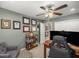 Comfortable bedroom with ceiling fan and hardwood floors at 4074 Sw 47Th Ct, Ocala, FL 34474