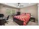 Bright bedroom with a window, bed, and workspace at 4074 Sw 47Th Ct, Ocala, FL 34474