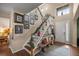 Bright entryway with staircase, decorative wall, and hardwood floors at 4074 Sw 47Th Ct, Ocala, FL 34474