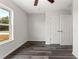 Well-lit bedroom with double-door closet and dark floors at 415 Malauka Radl, Ocklawaha, FL 32179