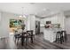 Well-equipped kitchen featuring white cabinets, granite countertops, and breakfast bar at 415 Malauka Radl, Ocklawaha, FL 32179