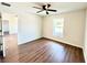 Spacious bedroom with hardwood floors and large window at 4310 Se 139Th Pl, Summerfield, FL 34491