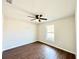 Well-lit bedroom with ceiling fan and hardwood floors at 4310 Se 139Th Pl, Summerfield, FL 34491