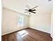 Bright bedroom with wood-look floors and ceiling fan at 4310 Se 139Th Pl, Summerfield, FL 34491