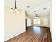 Bright dining room features hardwood floors, neutral walls, and a three-light fixture at 4310 Se 139Th Pl, Summerfield, FL 34491