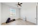 Bedroom with window, ceiling fan, and home gym equipment at 4388 Sw 56Th Pl, Ocala, FL 34474