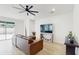 Living room with brown sectional sofa and access to the backyard at 4388 Sw 56Th Pl, Ocala, FL 34474