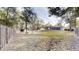 Spacious backyard with a large grassy area and privacy fence at 4475 Se 48Th Place Rd, Ocala, FL 34480