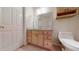 Simple bathroom with light wood cabinets and a double sink at 4475 Se 48Th Place Rd, Ocala, FL 34480