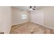 Simple bedroom with wood-look floors and double doors at 4475 Se 48Th Place Rd, Ocala, FL 34480