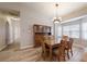 Bright dining area features hardwood floors and a bay window at 4475 Se 48Th Place Rd, Ocala, FL 34480