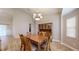 Bright dining room features a wood table and hutch at 4475 Se 48Th Place Rd, Ocala, FL 34480