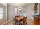 Formal dining room with a wooden table and chandelier at 4475 Se 48Th Place Rd, Ocala, FL 34480