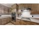 Modern kitchen with stainless steel appliances and wood cabinets at 4475 Se 48Th Place Rd, Ocala, FL 34480