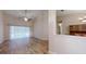 Bright living room with hardwood floors and sliding doors to the pool at 4475 Se 48Th Place Rd, Ocala, FL 34480